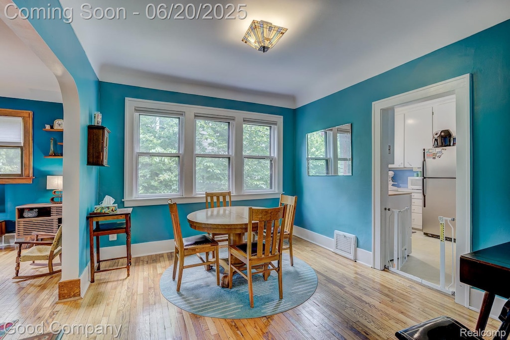925 W Hazelhurst St, Ferndale, MI 48220 - dining space with wood-type flooring and arched walkways