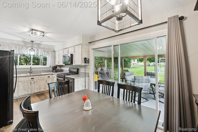 4098 Sam Snead Dr, Flint, MI 48506 - dining area featuring light wood finished floors