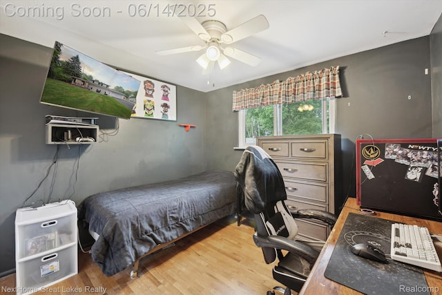 4098 Sam Snead Dr, Flint, MI 48506 - bedroom featuring wood finished floors, a desk, and ceiling fan