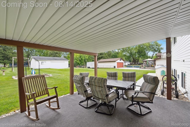 4098 Sam Snead Dr, Flint, MI 48506 - view of patio / terrace featuring outdoor dining area and an outdoor structure