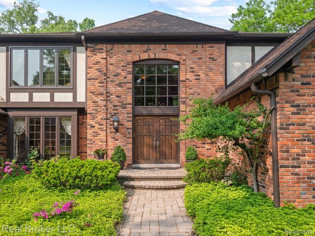 1299 Orchard Ridge Rd, Bloomfield Hills, MI 48304 - property entrance featuring brick siding and roof with shingles