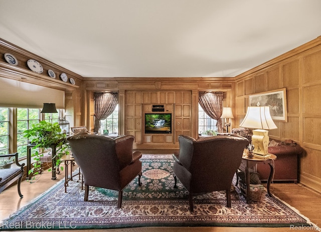 1299 Orchard Ridge Rd, Bloomfield Hills, MI 48304 - living room with plenty of natural light, wooden walls, crown molding, and wood finished floors
