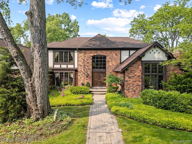 1299 Orchard Ridge Rd, Bloomfield Hills, MI 48304 - tudor-style house featuring brick siding and a shingled roof