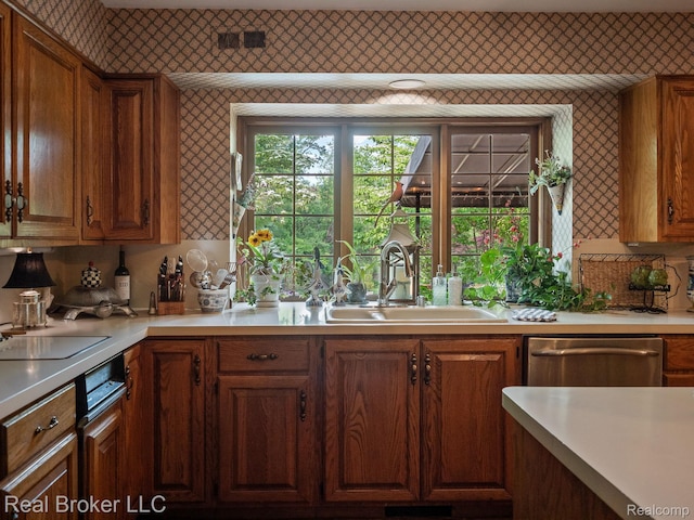 1299 Orchard Ridge Rd, Bloomfield Hills, MI 48304 - kitchen with dishwasher, light countertops, wallpapered walls, and brown cabinets