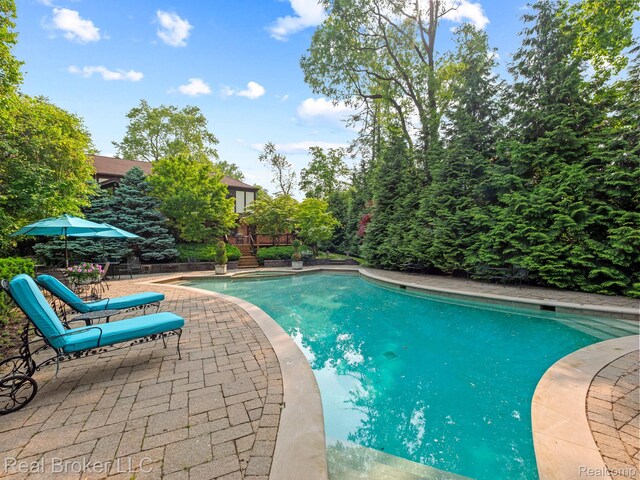 1299 Orchard Ridge Rd, Bloomfield Hills, MI 48304 - outdoor pool with a patio and a wooden deck
