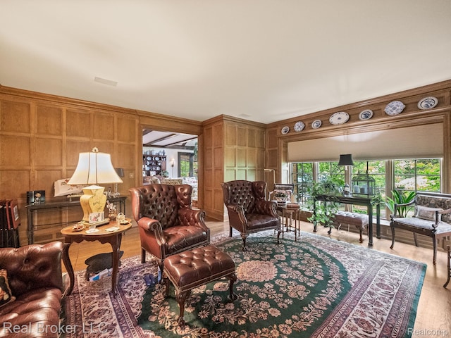 1299 Orchard Ridge Rd, Bloomfield Hills, MI 48304 - living room featuring wood finished floors, wood walls, and a decorative wall