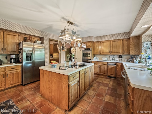 1299 Orchard Ridge Rd, Bloomfield Hills, MI 48304 - kitchen featuring appliances with stainless steel finishes, wallpapered walls, brown cabinetry, and light countertops