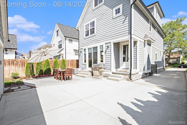 1060 Smith Ave, Birmingham, MI 48009 - rear view of house with a patio and outdoor dining space