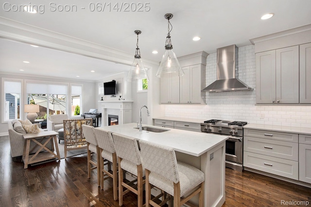1060 Smith Ave, Birmingham, MI 48009 - kitchen featuring wall chimney exhaust hood, high end stainless steel range, tasteful backsplash, open floor plan, and crown molding
