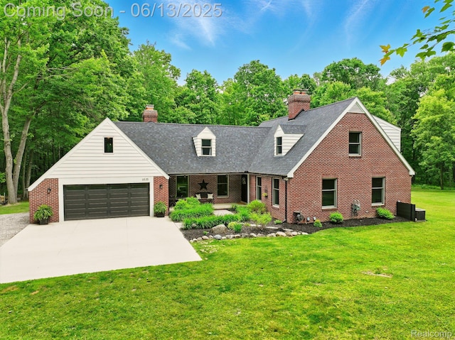 6535 Cedar Lake Rd, Pinckney, MI 48169 - cape cod-style house with brick siding, a front lawn, a chimney, and an attached garage