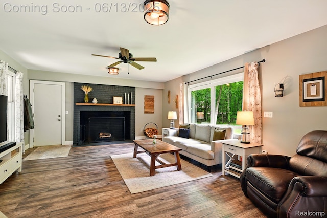 6535 Cedar Lake Rd, Pinckney, MI 48169 - living room featuring a ceiling fan, a fireplace, and dark wood finished floors