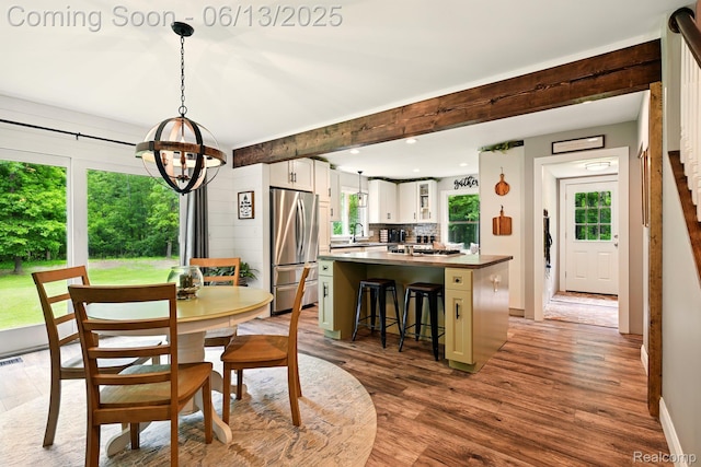 6535 Cedar Lake Rd, Pinckney, MI 48169 - dining space featuring a chandelier, light wood-style flooring, and recessed lighting