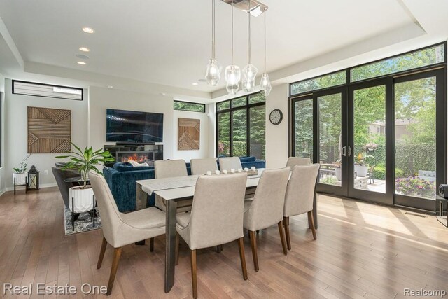 864 Cumberland Rdg Ct, Rochester, MI 48307 - dining area with french doors, wood-type flooring, recessed lighting, and a raised ceiling