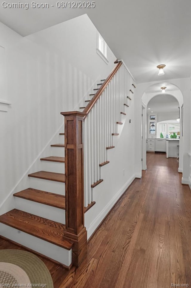 1260 W Ann Arbor Trl, Plymouth, MI 48170 - stairs featuring wood finished floors and arched walkways