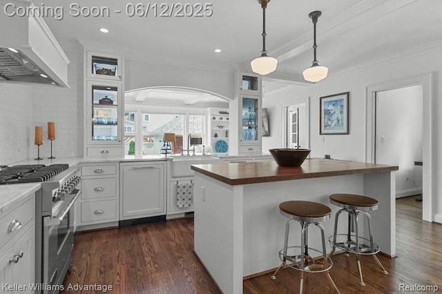 1260 W Ann Arbor Trl, Plymouth, MI 48170 - kitchen featuring wall chimney range hood, high end stainless steel range oven, butcher block countertops, ornamental molding, and arched walkways