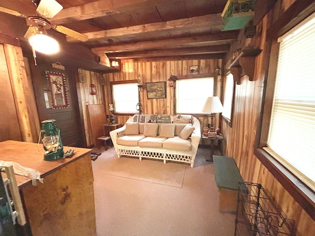 2112 Timber Ln, Brooklyn, MI 49230 - living area featuring wood walls, ceiling fan, plenty of natural light, and a wood ceiling with exposed beams