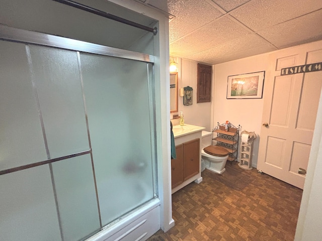2112 Timber Ln, Brooklyn, MI 49230 - bathroom featuring vanity, a paneled ceiling, and shower / bath combination with glass door