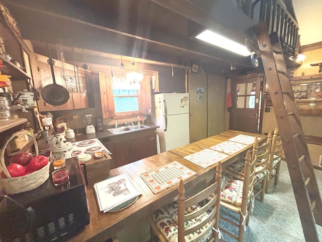 2112 Timber Ln, Brooklyn, MI 49230 - kitchen featuring freestanding refrigerator and a sink