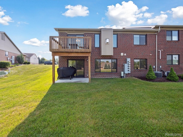 1470 Duncan Dr, Chelsea, MI 48118 - rear view of house featuring a yard, brick siding, and a balcony