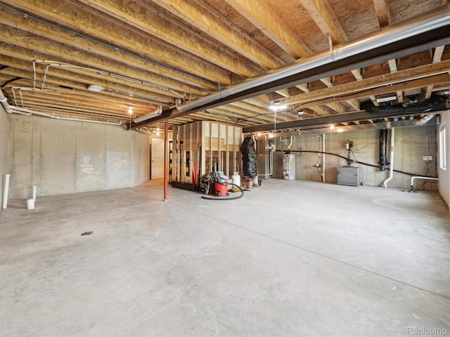 1470 Duncan Dr, Chelsea, MI 48118 - unfinished below grade area featuring gas water heater