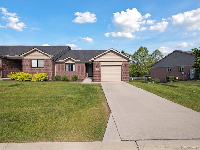 1470 Duncan Dr, Chelsea, MI 48118 - ranch-style house featuring driveway, an attached garage, brick siding, and a front yard