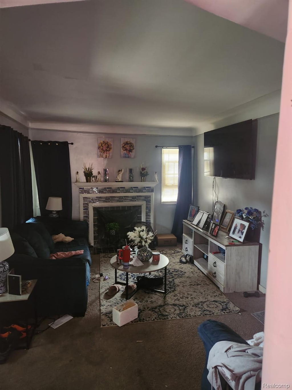 14750 Lannette St, Detroit, MI 48213 - carpeted living room featuring a fireplace