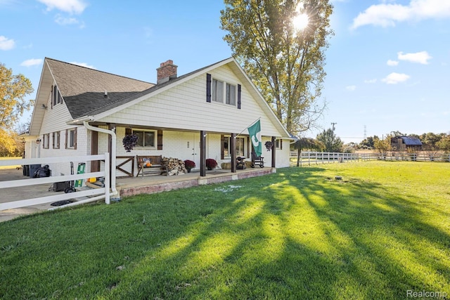 3985 Wadhams Rd, China, MI 48054 - view of front of house with a chimney, a shingled roof, a porch, and brick siding