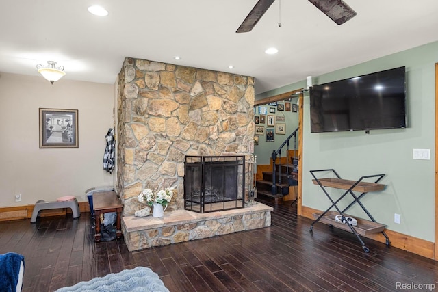 3985 Wadhams Rd, China, MI 48054 - living area featuring wood finished floors, a stone fireplace, ceiling fan, stairs, and recessed lighting