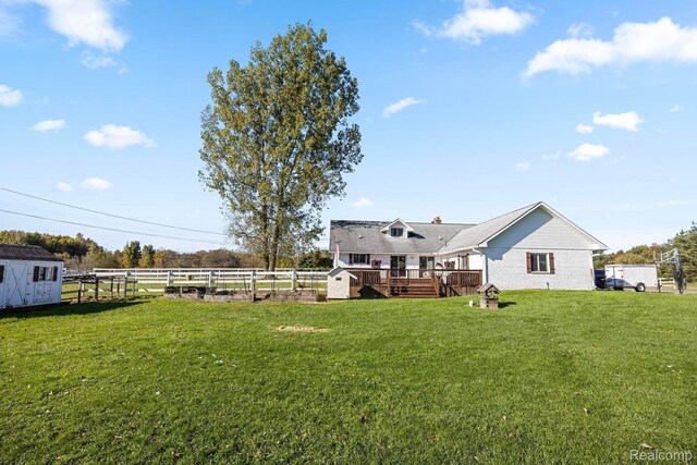3985 Wadhams Rd, China, MI 48054 - view of yard featuring a wooden deck and a storage shed
