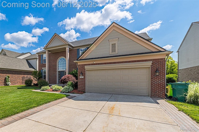 49620 Dunhill Dr, Macomb, MI 48044 - traditional home with brick siding, a front lawn, and driveway