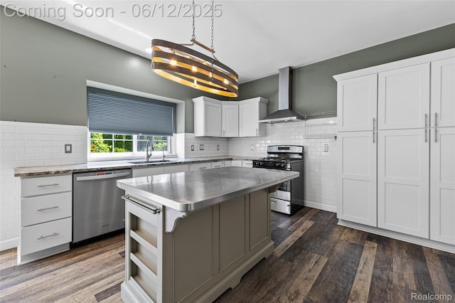 49620 Dunhill Dr, Macomb, MI 48044 - kitchen with appliances with stainless steel finishes, wall chimney range hood, white cabinets, and dark wood finished floors