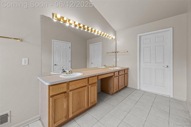 49620 Dunhill Dr, Macomb, MI 48044 - bathroom featuring lofted ceiling, double vanity, and tile patterned floors