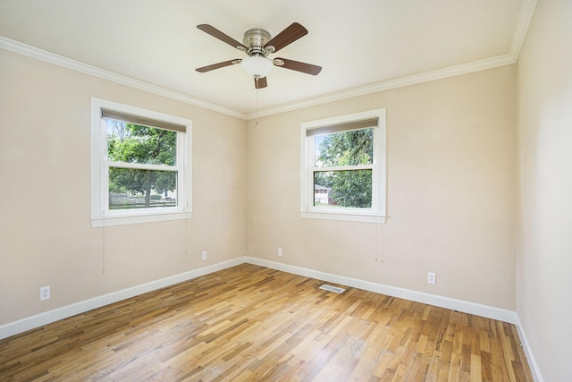 6037 Cypress St, Portage, MI 49024 - empty room featuring plenty of natural light, light wood finished floors, crown molding, and ceiling fan