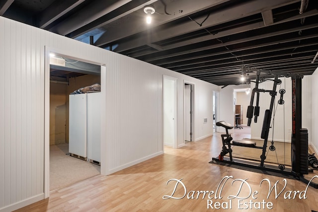6662 Adaridge Dr SE, Ada, MI 49301 - exercise room featuring wood finished floors and baseboards
