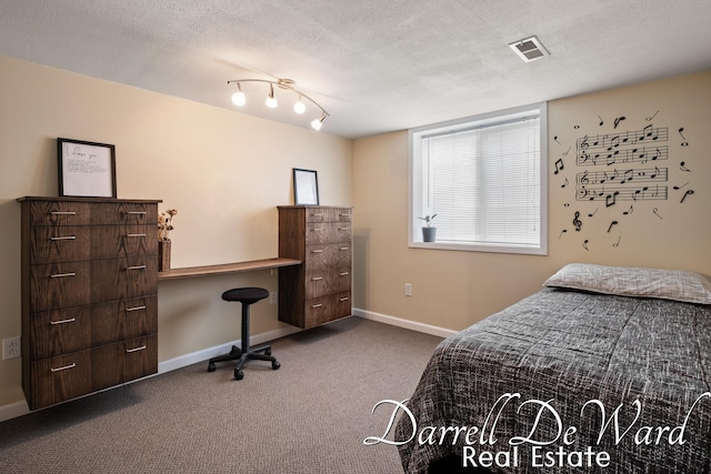 6662 Adaridge Dr SE, Ada, MI 49301 - bedroom with carpet flooring, a desk, and a textured ceiling