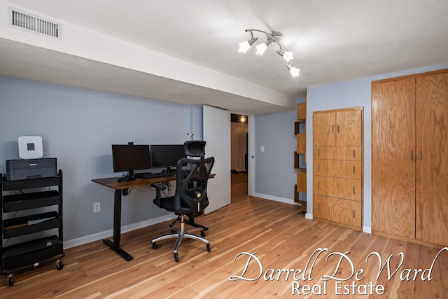6662 Adaridge Dr SE, Ada, MI 49301 - office area with light wood-style floors and baseboards