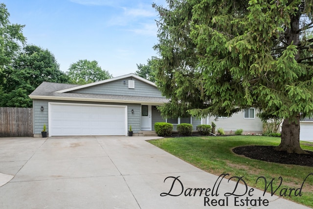 6662 Adaridge Dr SE, Ada, MI 49301 - single story home featuring concrete driveway and an attached garage