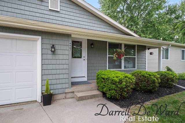 6662 Adaridge Dr SE, Ada, MI 49301 - view of exterior entry with a porch
