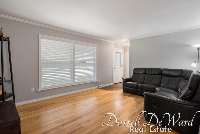 6662 Adaridge Dr SE, Ada, MI 49301 - living room featuring ornamental molding and wood finished floors