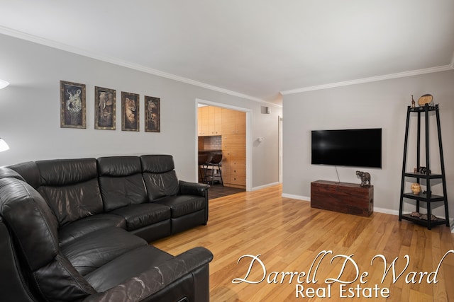 6662 Adaridge Dr SE, Ada, MI 49301 - living area featuring ornamental molding and wood finished floors