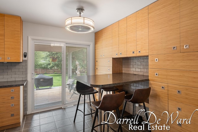 6662 Adaridge Dr SE, Ada, MI 49301 - dining space with dark tile patterned flooring