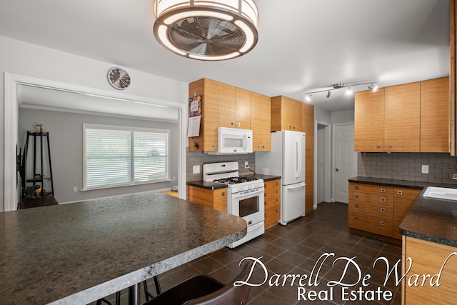 6662 Adaridge Dr SE, Ada, MI 49301 - kitchen with white appliances, dark countertops, backsplash, and ceiling fan