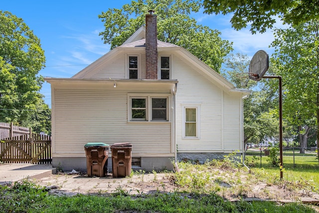 505 Fitch St, Albion, MI 49224 - back of house with a chimney