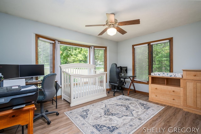5151 Scotch Mist Dr, Saranac, MI 48881 - bedroom featuring an office area, wood finished floors, and ceiling fan