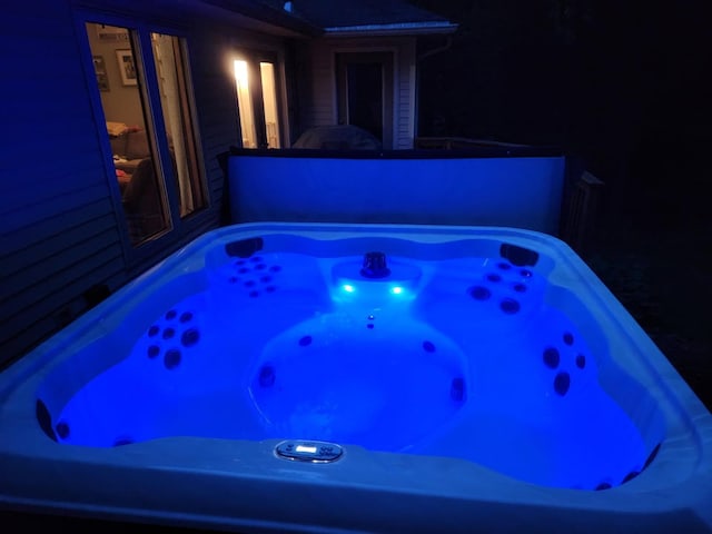 5151 Scotch Mist Dr, Saranac, MI 48881 - pool at twilight with a hot tub