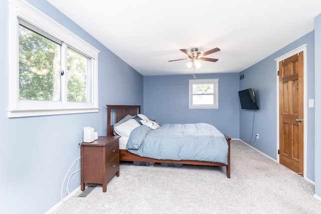 680 Eastlook Dr, Saline, MI 48176 - carpeted bedroom with baseboards and a ceiling fan