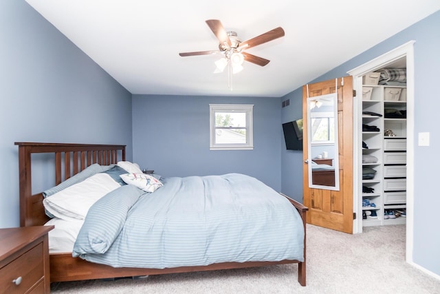 680 Eastlook Dr, Saline, MI 48176 - bedroom featuring light carpet, a spacious closet, a ceiling fan, and a closet
