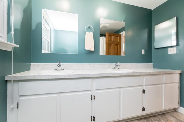 680 Eastlook Dr, Saline, MI 48176 - bathroom with double vanity and wood finished floors