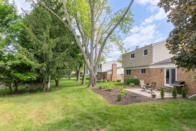 680 Eastlook Dr, Saline, MI 48176 - view of grassy yard with a patio area