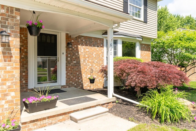 680 Eastlook Dr, Saline, MI 48176 - property entrance featuring brick siding and covered porch